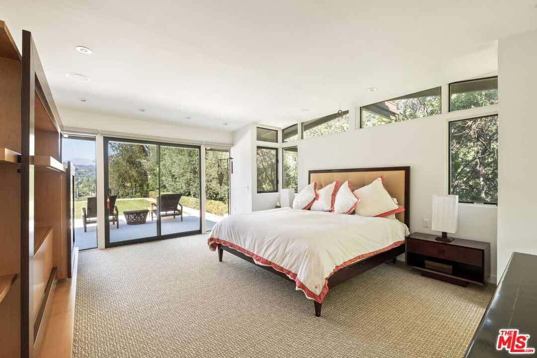 1161 Romney Drive Pasadena, CA 91105 - Photo 14 of 29 a bed sitting in a bedroom next to a window