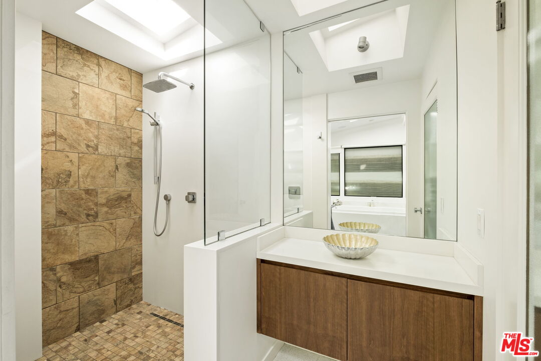 1161 Romney Drive Pasadena, CA 91105 - Photo 16 of 29 a bathroom with a double vanity sink and a mirror