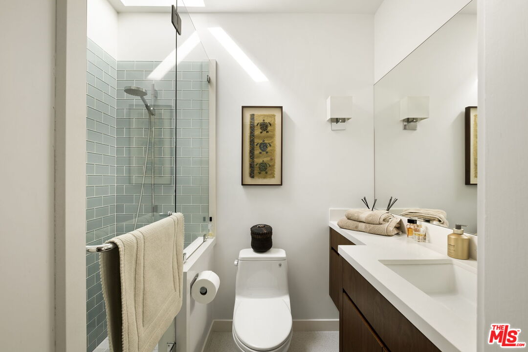 1161 Romney Drive Pasadena, CA 91105 - Photo 21 of 29 a bathroom with a toilet sink and mirror