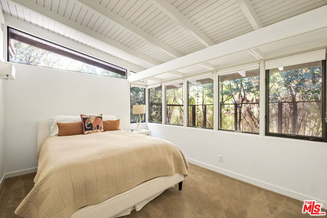 1161 Romney Drive Pasadena, CA 91105 - Photo 22 of 29 a bedroom with a large bed and a large window