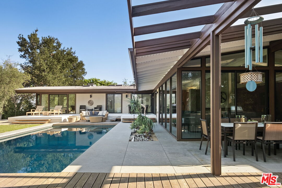 1161 Romney Drive Pasadena, CA 91105 - Photo 25 of 29 a view of a swimming pool with chairs in patio