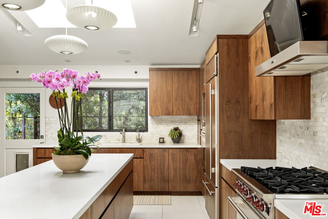 1161 Romney Drive Pasadena, CA 91105 - Photo 5 of 29 a kitchen with a sink and a stove