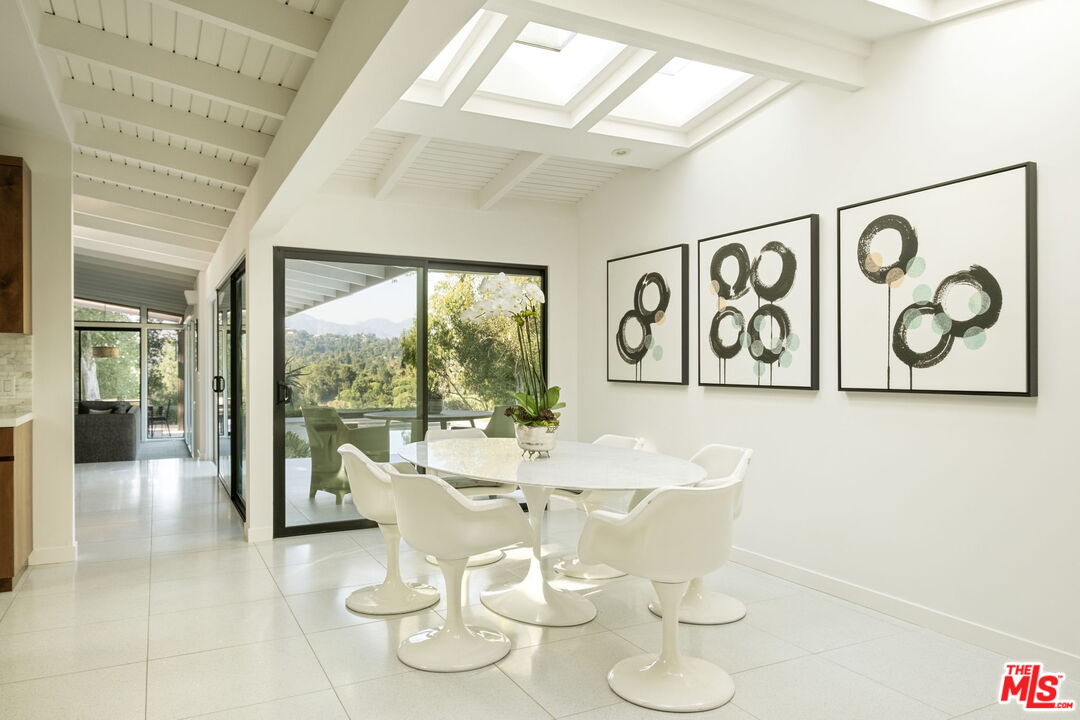 1161 Romney Drive Pasadena, CA 91105 - Photo 8 of 29 a dining room with wooden floor and large windows