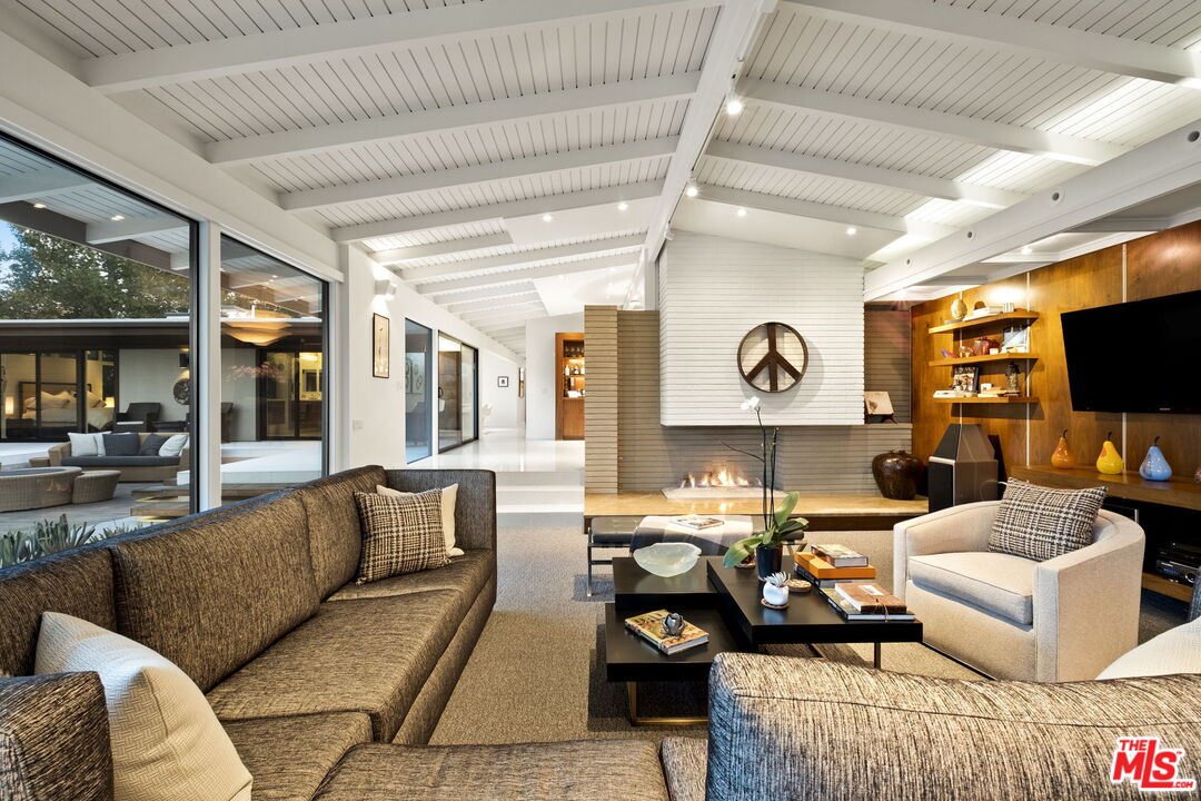 1161 Romney Drive Pasadena, CA 91105 - Photo 9 of 29 a living room with furniture and a flat screen tv