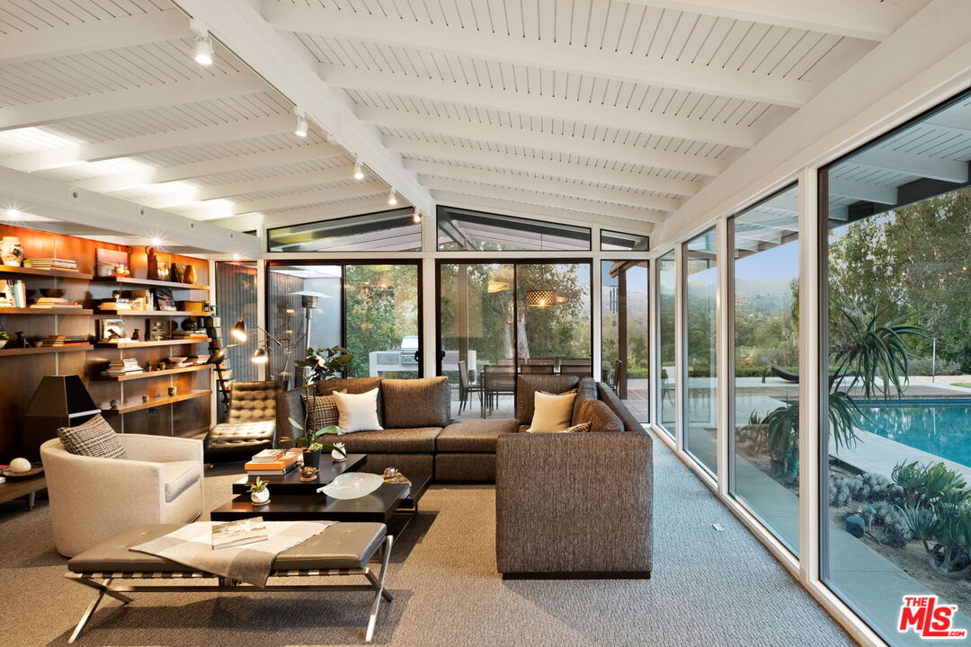 1161 Romney Drive Pasadena, CA 91105 - Photo 10 of 29 a living room with furniture and a floor to ceiling window