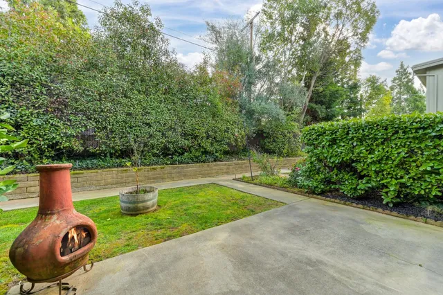a front view of a house with a yard and porch
