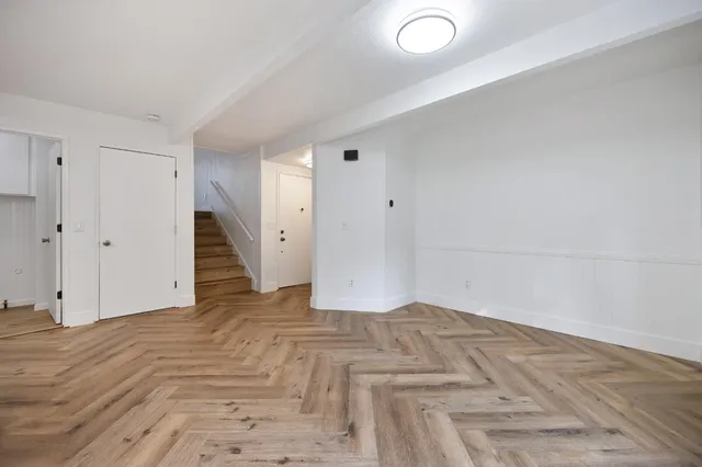 a view of a hallway view with staircase