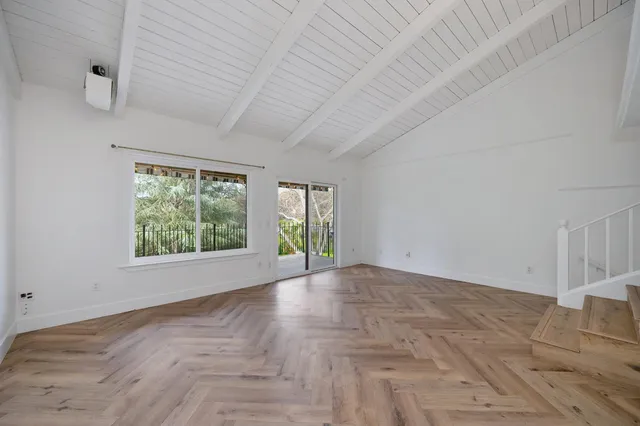 a view of a room with large windows