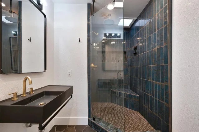 a view of an empty room and wooden floor