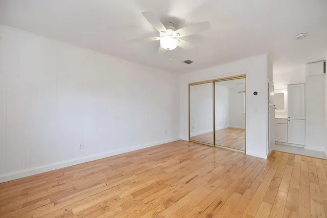 an aerial view of multiple houses with yard