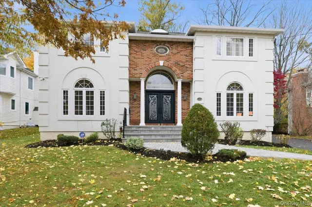 a front view of a house with garden