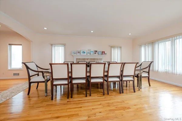 a view of a a dining room with furniture and wooden floor