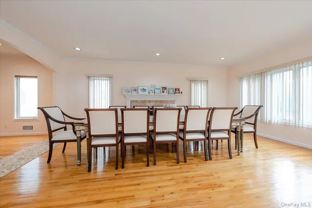 a view of a a dining room with furniture and wooden floor