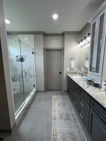 a bathroom with a double vanity sink and a mirror