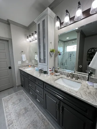 a bathroom with a sink double vanity and a mirror