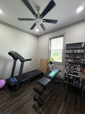a living room with furniture a rug and a window