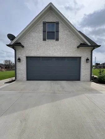 a front view of a house with a garage
