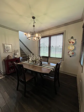 a view of a dining room with furniture and window