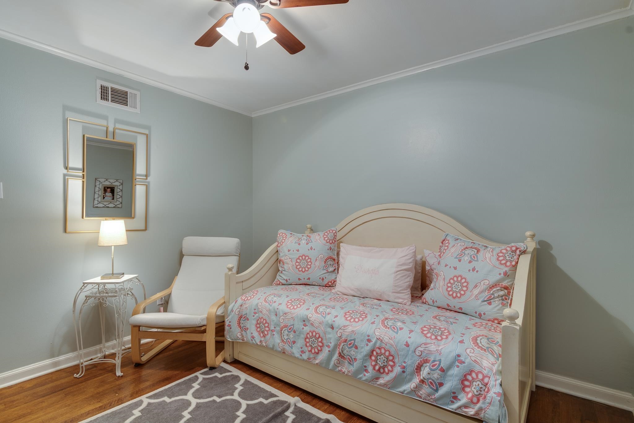 337 North White Station Road Memphis, TN 38117 - Photo 21 of 37 Bedroom with baseboards, crown molding, visible vents, and wood finished floors