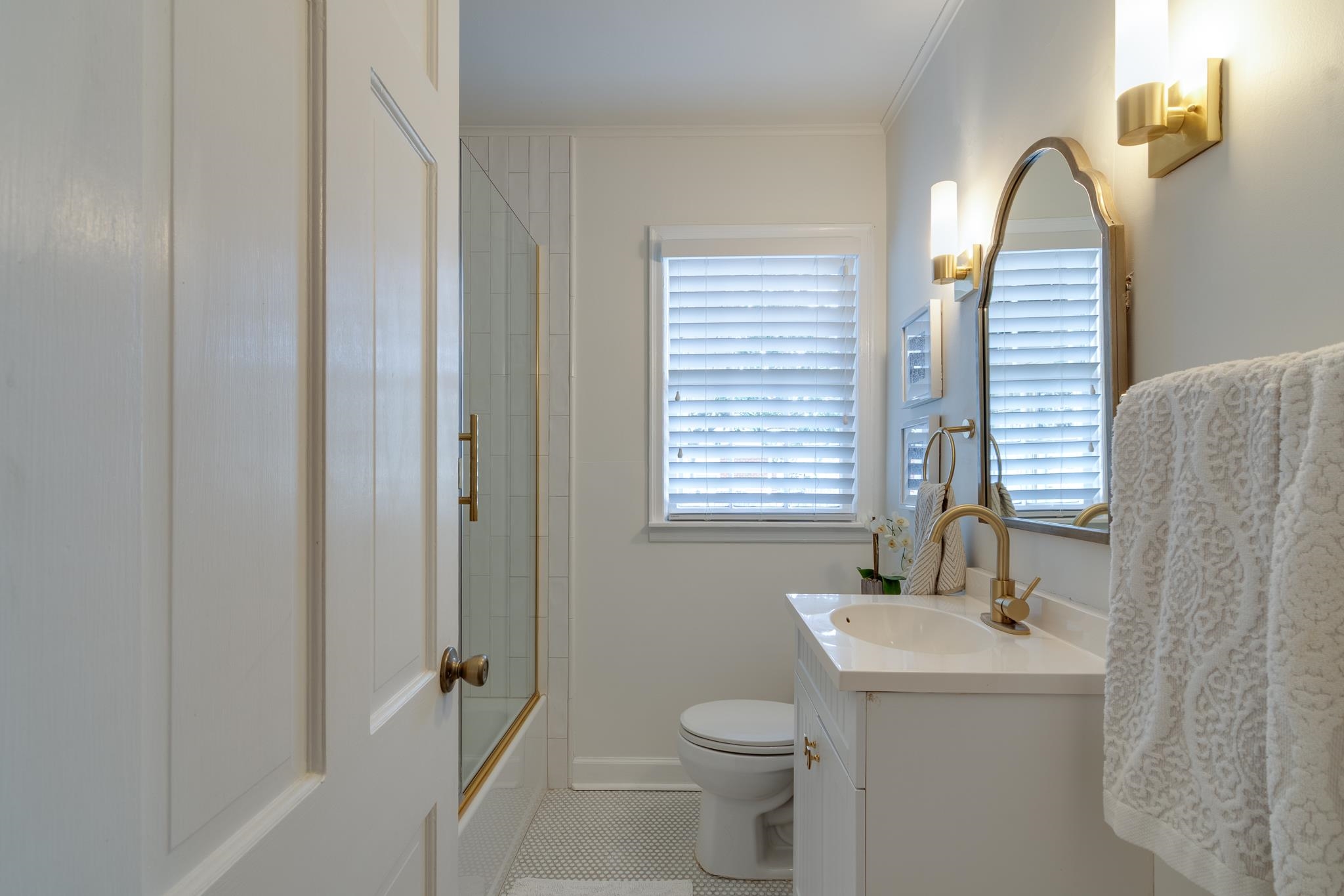 337 North White Station Road Memphis, TN 38117 - Photo 22 of 37 Full bath with toilet, vanity, combined bath / shower with glass door, tile patterned floors, and crown molding