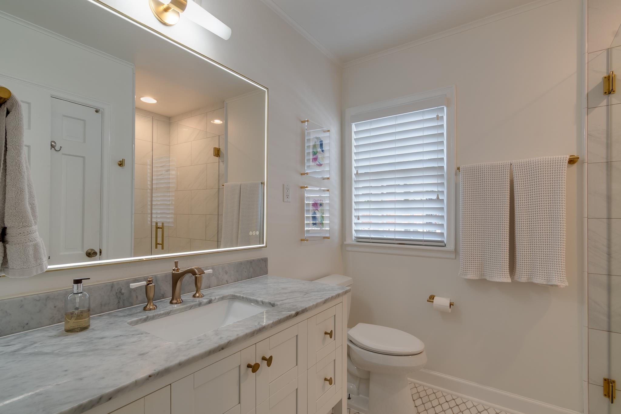 337 North White Station Road Memphis, TN 38117 - Photo 27 of 37 Full bathroom featuring baseboards, toilet, crown molding, vanity, and a shower stall