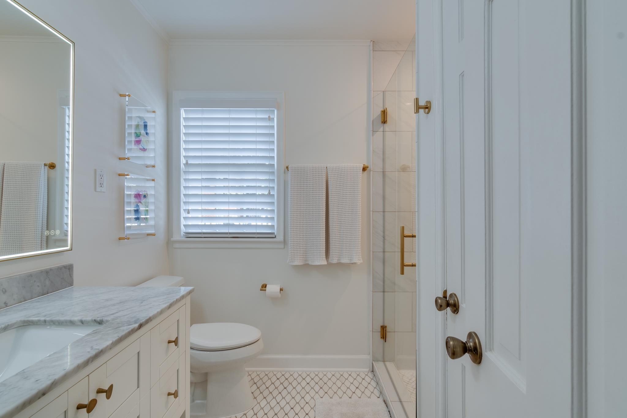 337 North White Station Road Memphis, TN 38117 - Photo 28 of 37 Bathroom with vanity, baseboards, ornamental molding, tile patterned floors, and a stall shower