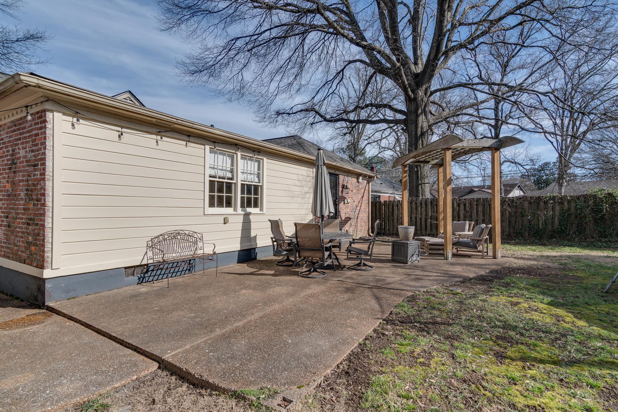 337 North White Station Road Memphis, TN 38117 - Photo 35 of 37 Exterior space with a patio, brick siding, crawl space, and fence