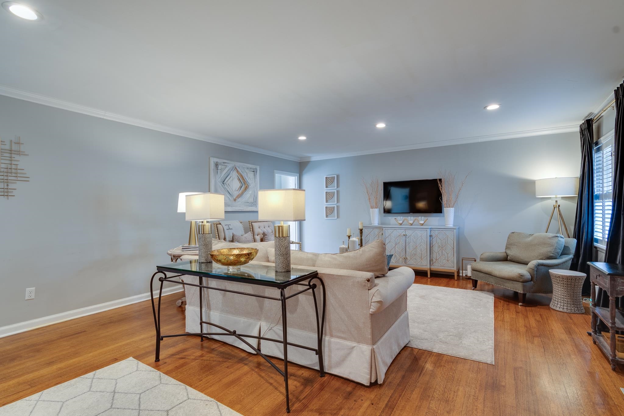 337 North White Station Road Memphis, TN 38117 - Photo 4 of 37 Living room featuring light wood-style flooring, baseboards, crown molding, and recessed lighting