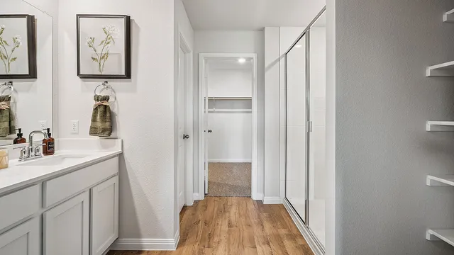 a bathroom with a sink and mirror