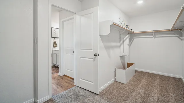 a view of a room with white walls