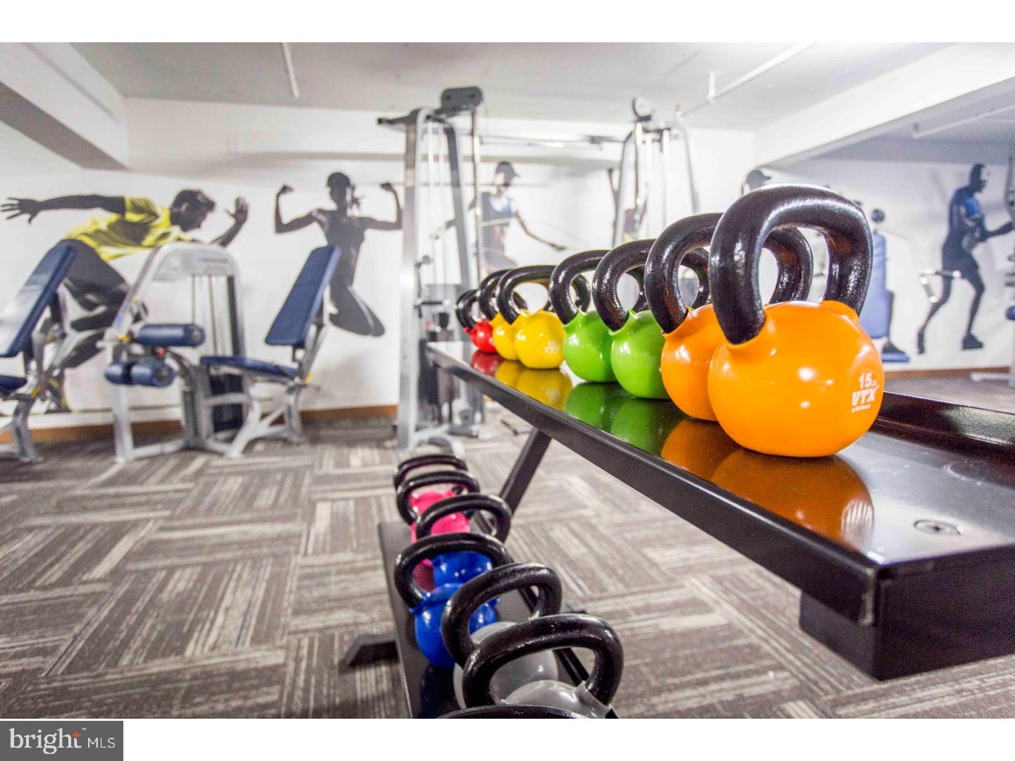 2201 Pennsylvania Avenue, Unit 808 Philadelphia, PA 19130 - Photo 18 of 45 a living room with table gym equipment