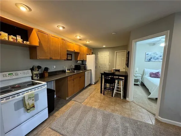 a kitchen with a sink appliances and cabinets