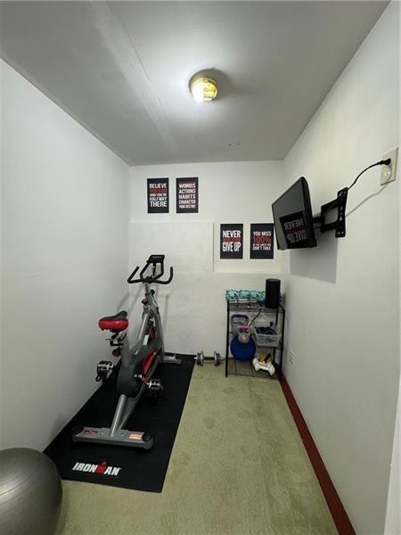 415 Holland Springs Drive Northwest, Unit TERRAC Powder Springs, GA 30127 - Photo 20 of 24 a view of a room with gym equipment