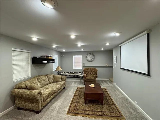 a living room with furniture and a rug