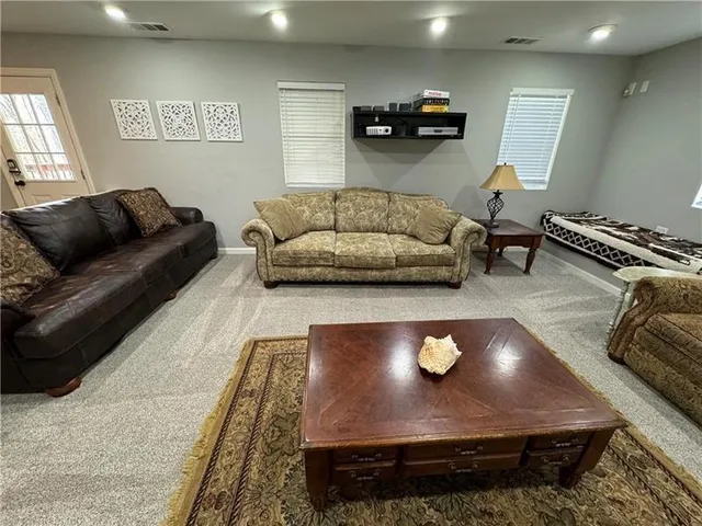 a living room with furniture and a couch