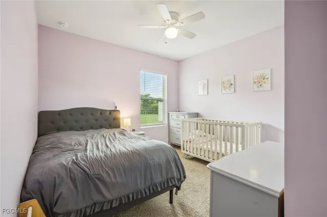 a bedroom with a bed and a chair