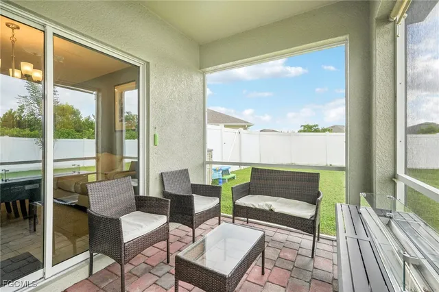 a backyard of a house with barbeque oven and garden