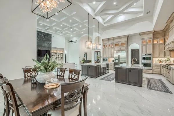 a view of empty room with wooden floor and ceiling fan