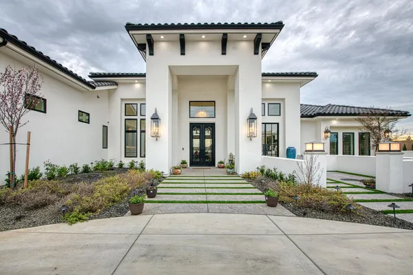 a large kitchen with a large counter top appliances and cabinets