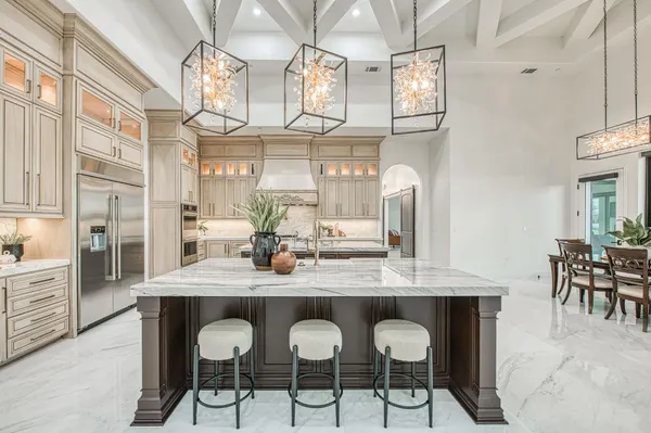 a bathroom with a sink a light fixture and a mirror