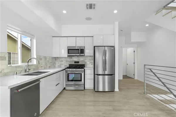 a view of kitchen with wooden floor