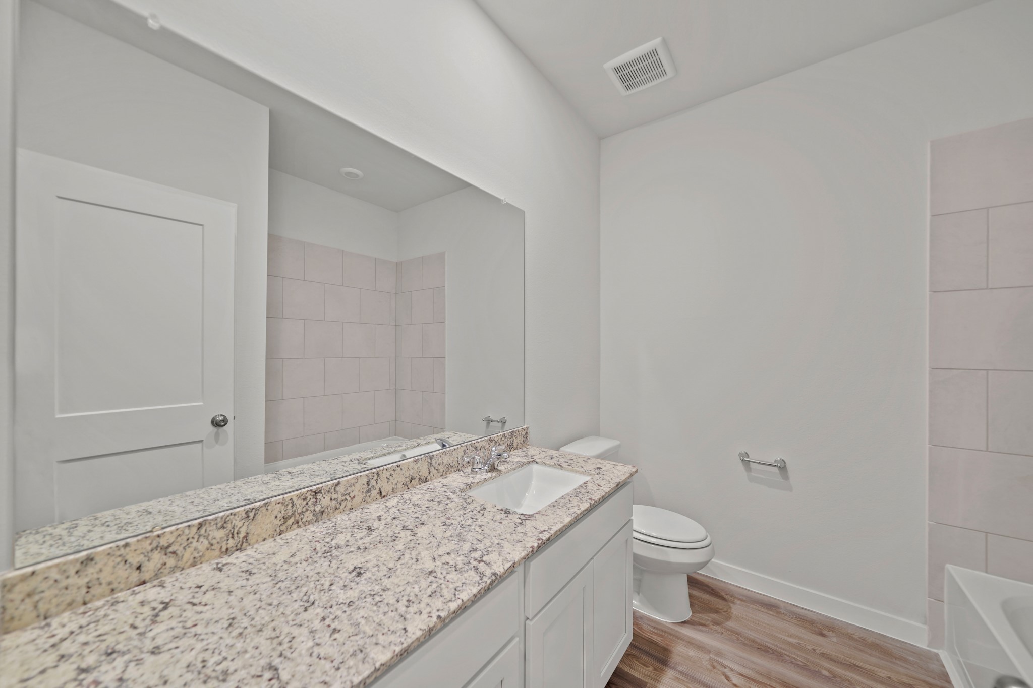 14405 Elmfield Lane Conroe, TX 77303 - Photo 12 of 22 a bathroom with a granite countertop sink a toilet and shower