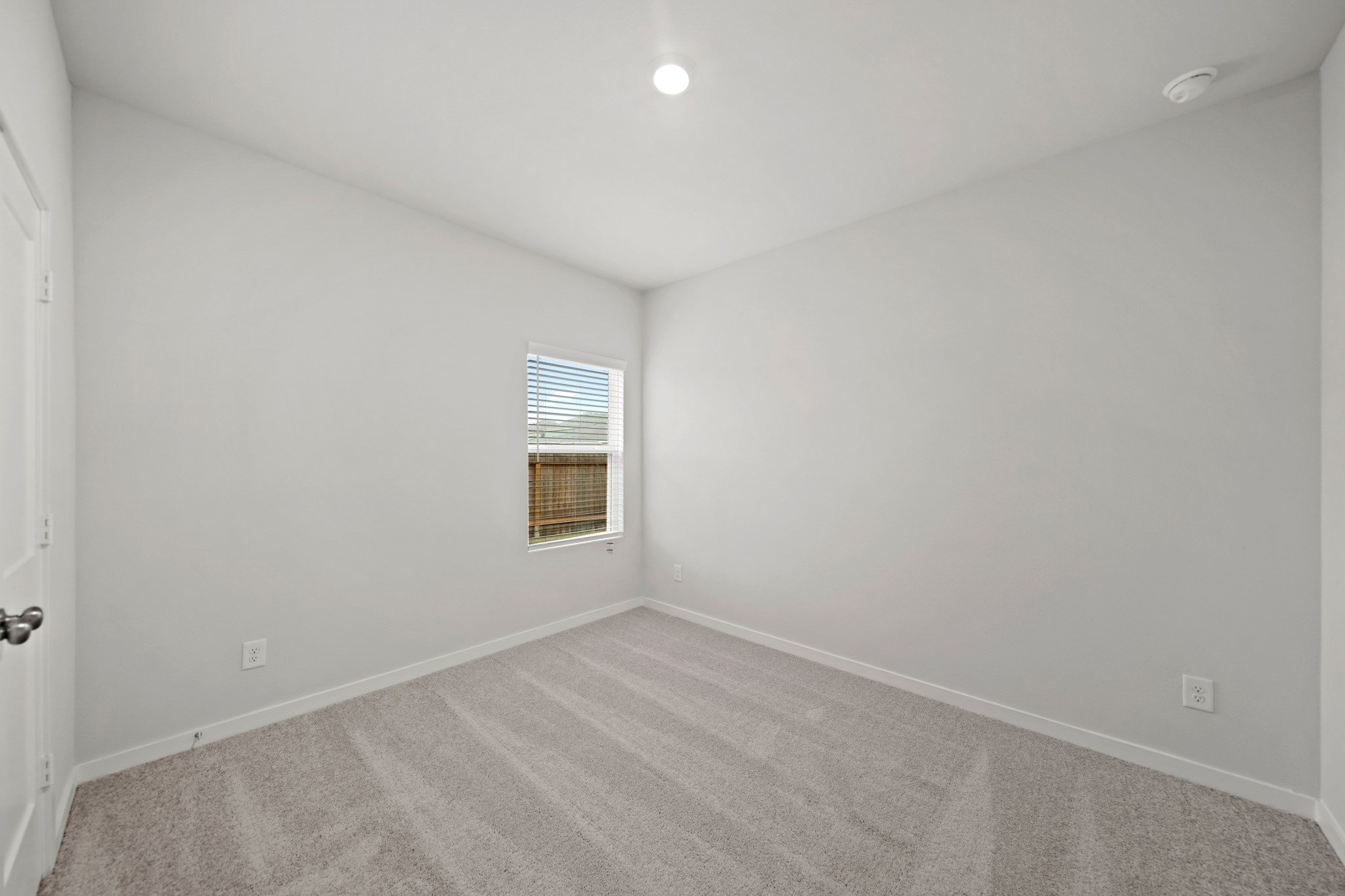 14405 Elmfield Lane Conroe, TX 77303 - Photo 13 of 22 an empty room with a window