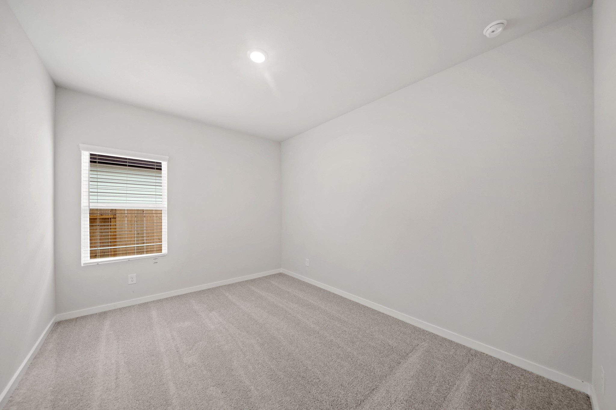 14405 Elmfield Lane Conroe, TX 77303 - Photo 14 of 22 an empty room with a window