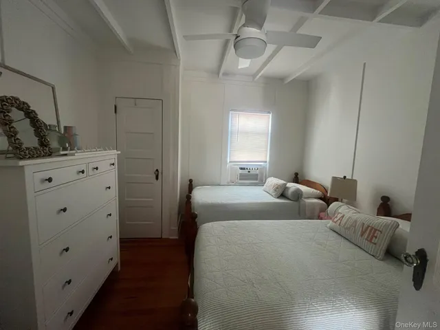 a bed room with two bed and a closet