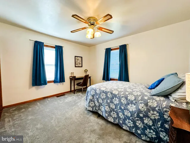 a bedroom with bed and window