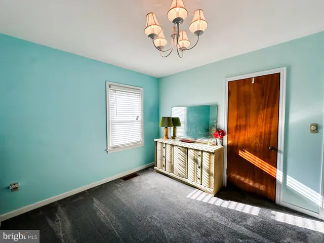 a view of an empty room and a window