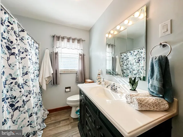 a bathroom with a sink double vanity and a mirror