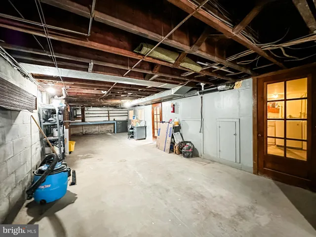 a view of empty room with wooden walls