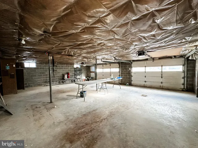 a view of a garage with wooden ceiling